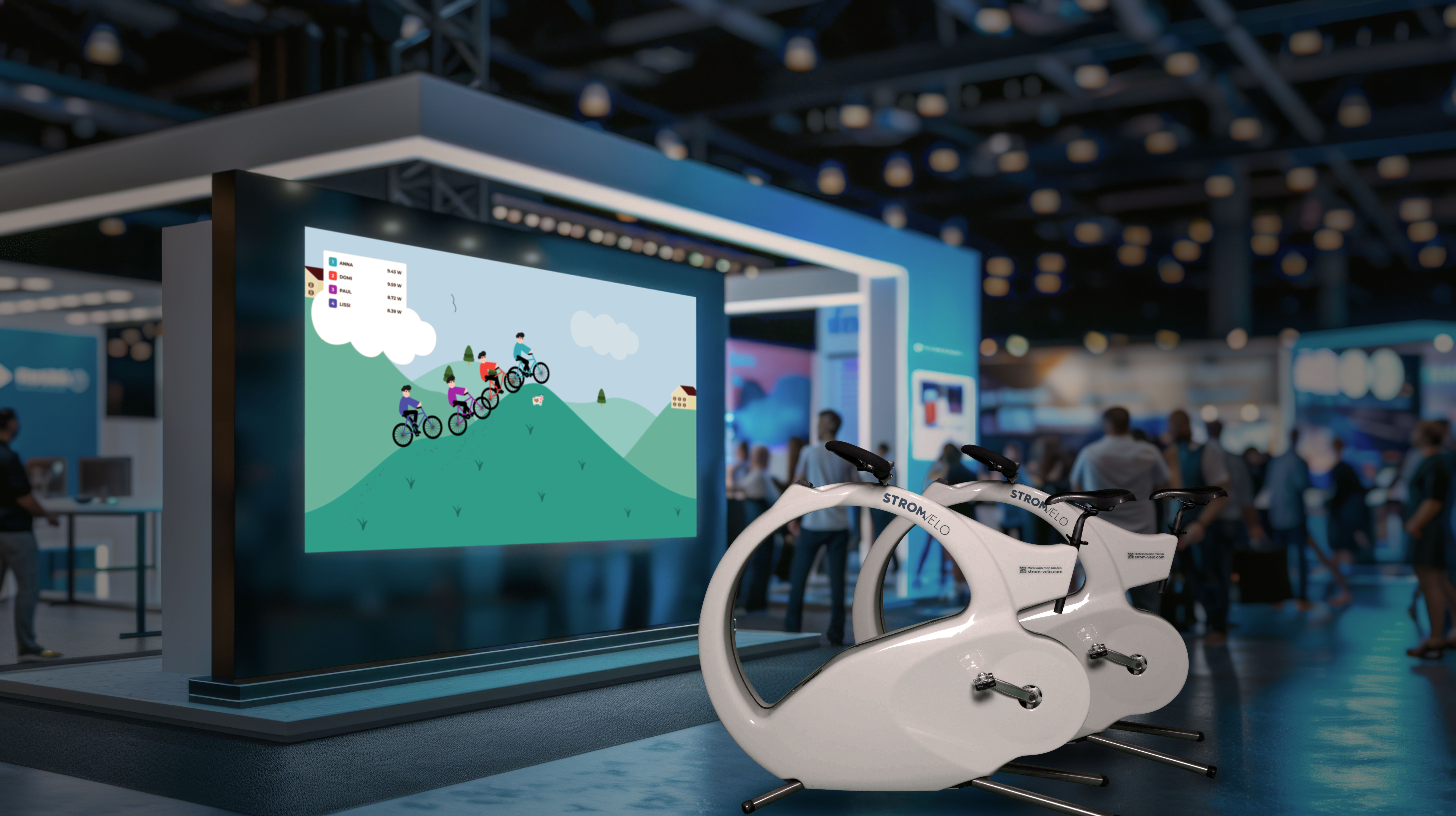 Exhibit booth with white stationary bikes in foreground and a large display showing a cartoon hill with cyclists on a mountain ride.